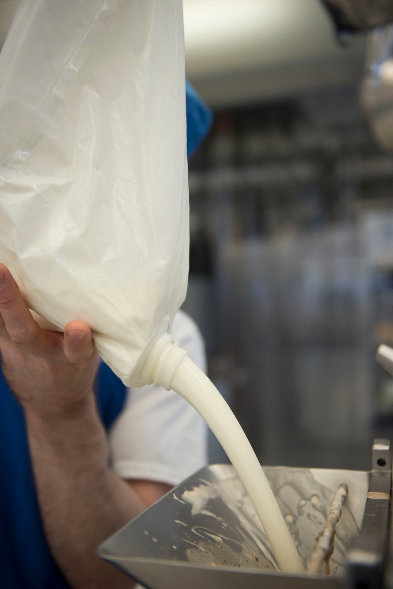 Fresh milk poured into a gelato machine, the base made with natural cane sugar